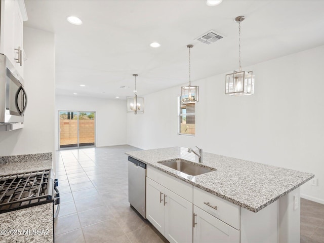 kitchen featuring a sink, a wealth of natural light, stainless steel appliances, and visible vents
