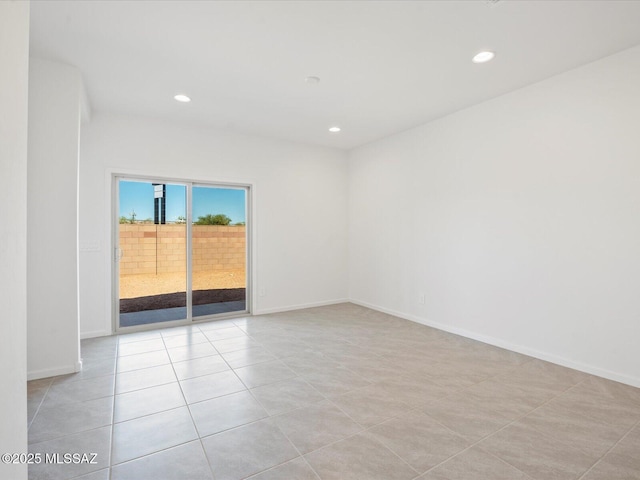 unfurnished room with recessed lighting, baseboards, and light tile patterned floors