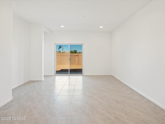 spare room featuring recessed lighting, baseboards, and light tile patterned flooring