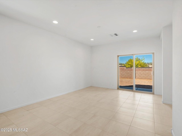 spare room with visible vents, recessed lighting, and baseboards