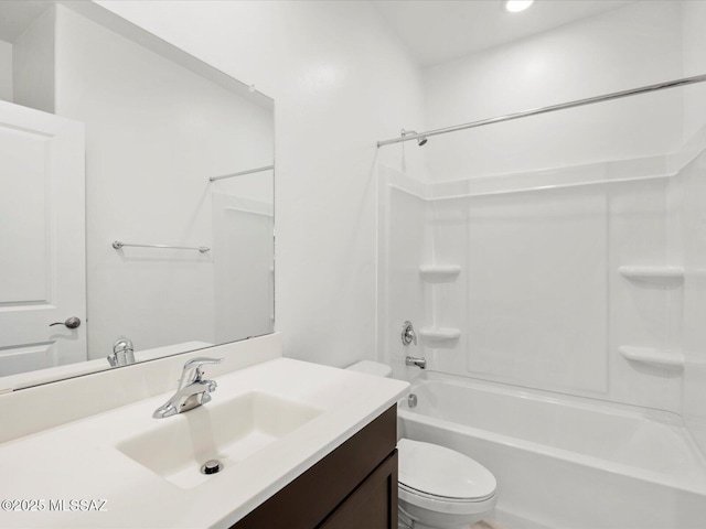 bathroom with recessed lighting, vanity, toilet, and shower / washtub combination
