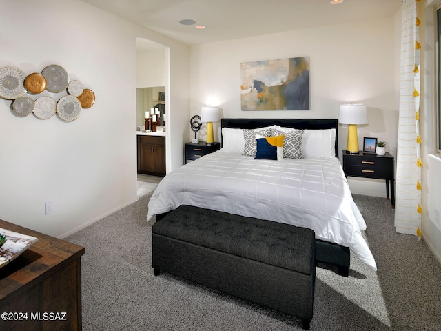 carpeted bedroom with baseboards, recessed lighting, and connected bathroom