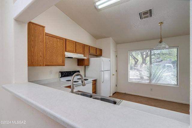 kitchen featuring white appliances, decorative light fixtures, sink, carpet, and vaulted ceiling