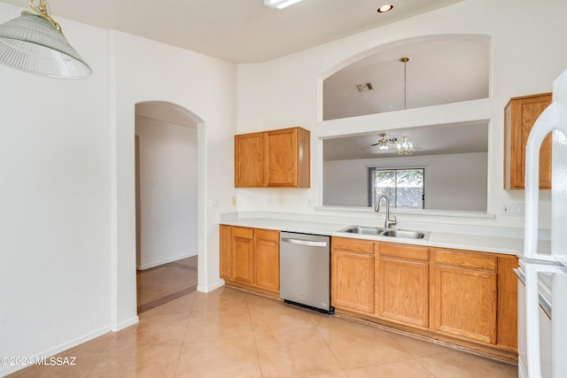 kitchen with decorative light fixtures, light tile patterned floors, sink, and stainless steel dishwasher