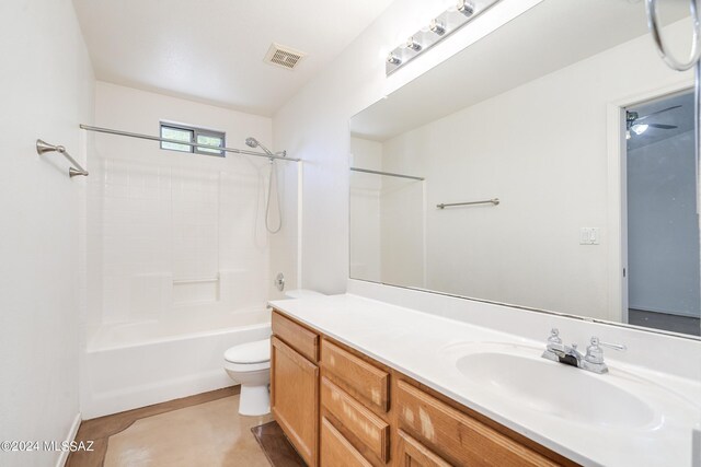 full bathroom with tile patterned floors, vanity, toilet, and shower / washtub combination