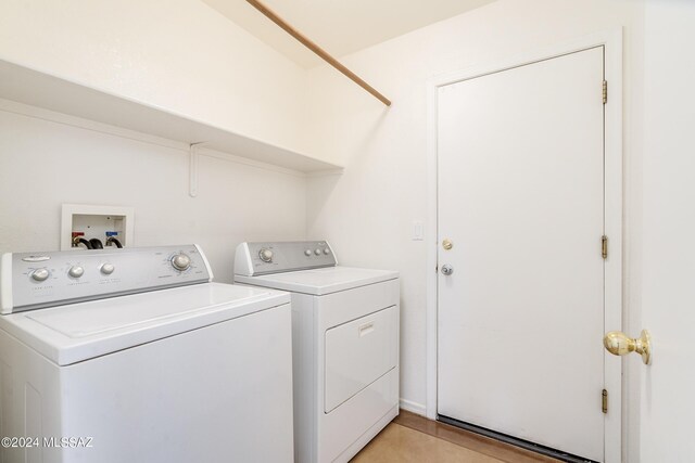 laundry room with separate washer and dryer