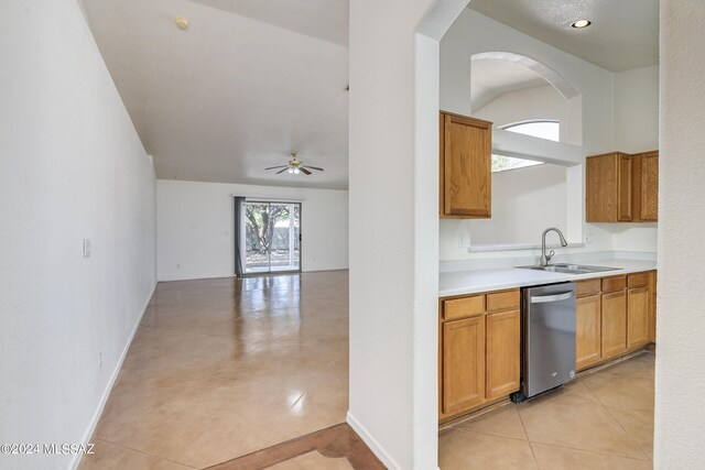 kitchen featuring dishwasher, ceiling fan, sink, and light tile patterned flooring