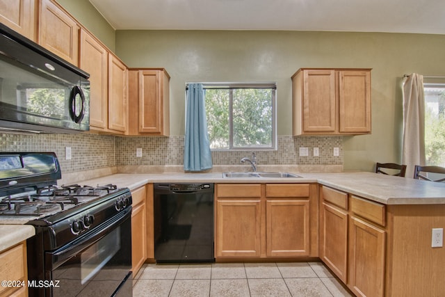 kitchen featuring black appliances, tasteful backsplash, light tile patterned flooring, sink, and kitchen peninsula