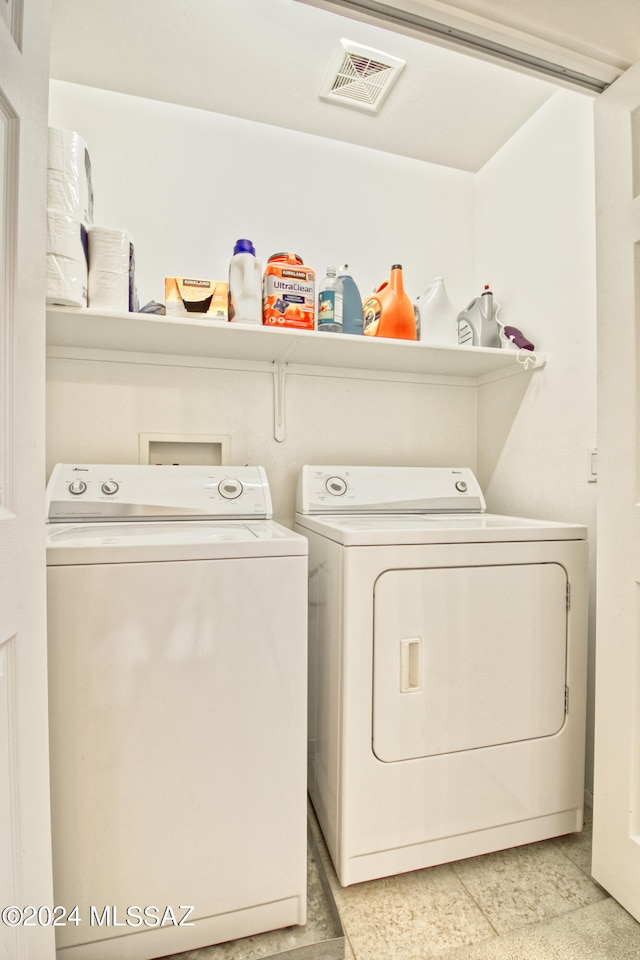 clothes washing area featuring washing machine and dryer