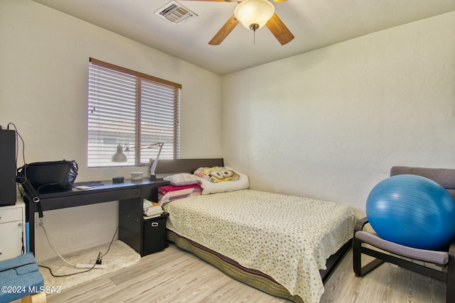 bedroom with light wood-type flooring and ceiling fan