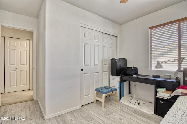 office with light hardwood / wood-style floors