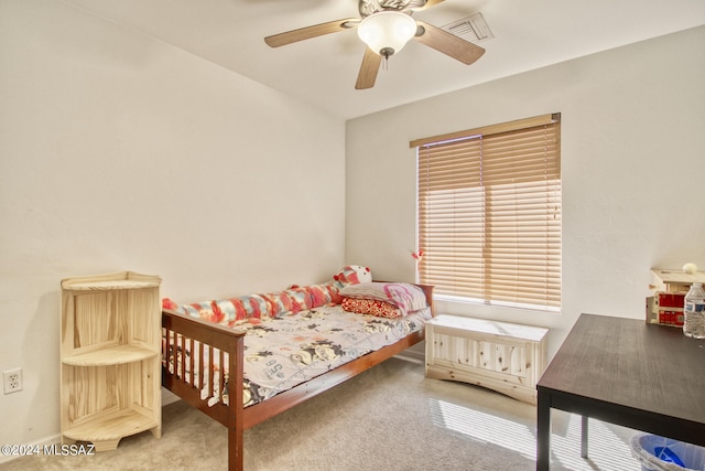 bedroom with ceiling fan and carpet