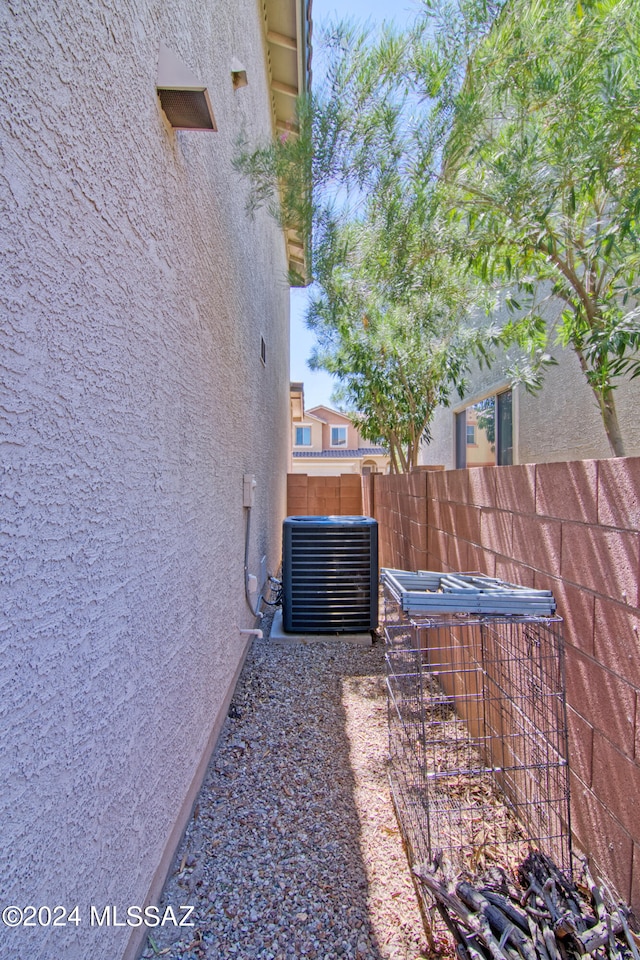 view of side of property with central AC