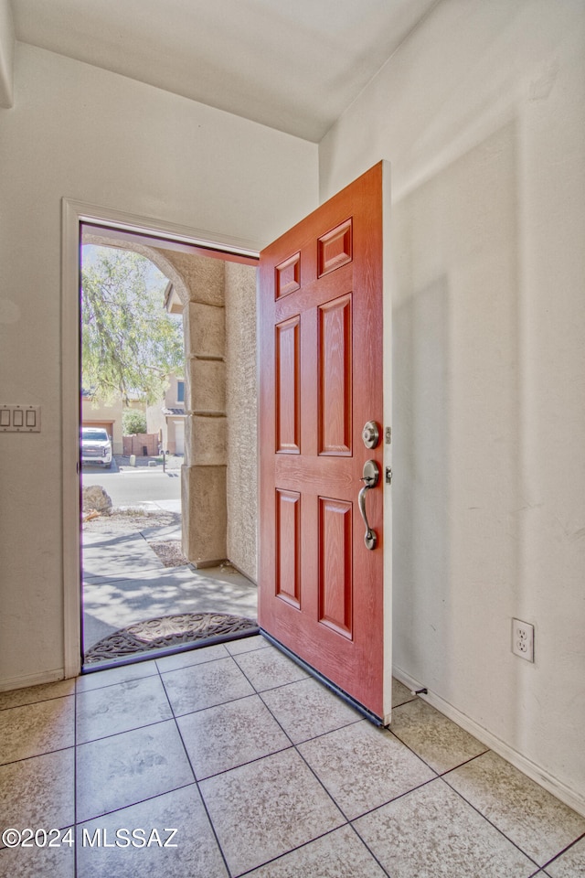 foyer entrance featuring light tile patterned floors