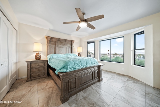 bedroom with a closet and ceiling fan