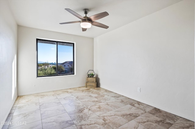 spare room featuring ceiling fan