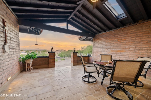 view of patio terrace at dusk