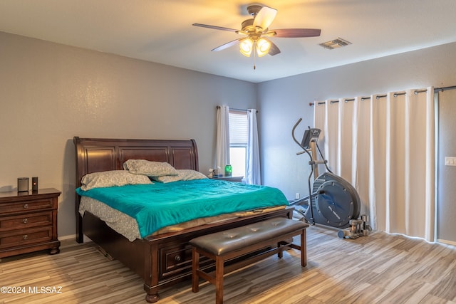 bedroom with ceiling fan and light wood-type flooring