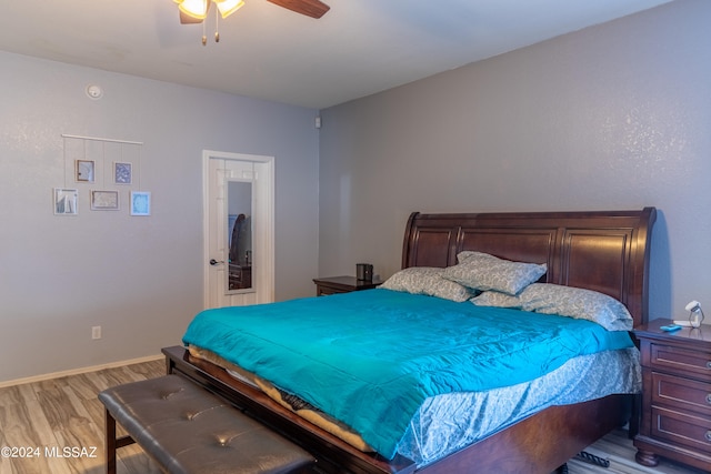 bedroom featuring light wood-type flooring and ceiling fan