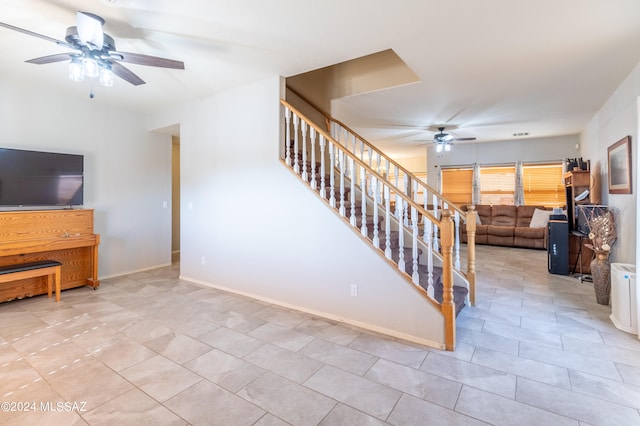 interior space with ceiling fan and light tile patterned floors