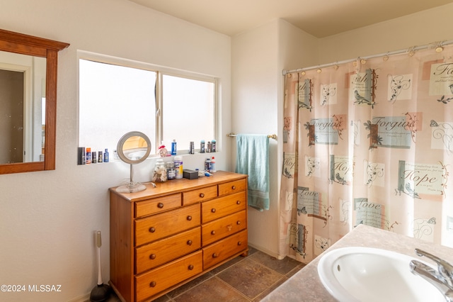 bathroom with vanity and tile patterned floors