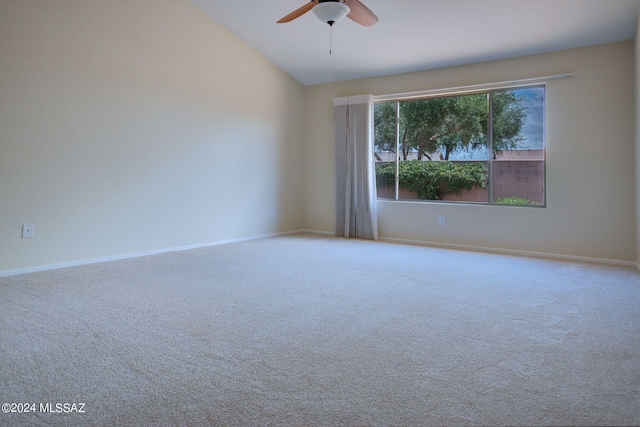 carpeted spare room with lofted ceiling and ceiling fan