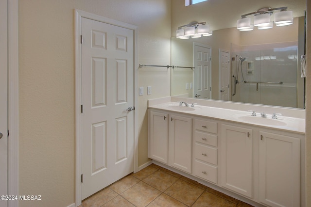 bathroom with vanity, tile patterned flooring, and an enclosed shower