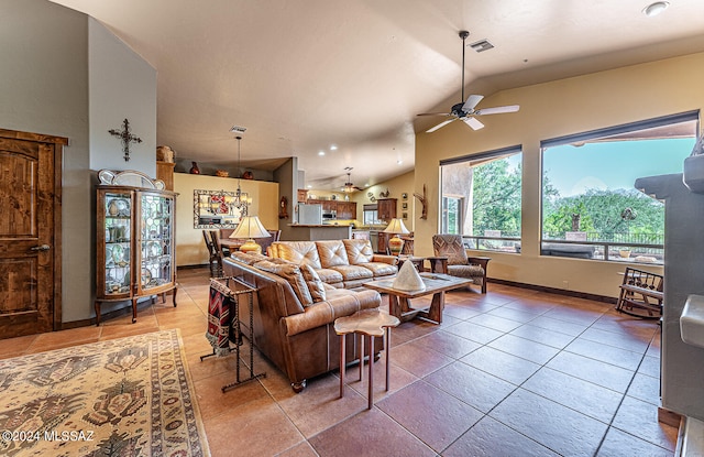 tiled living room with lofted ceiling and ceiling fan