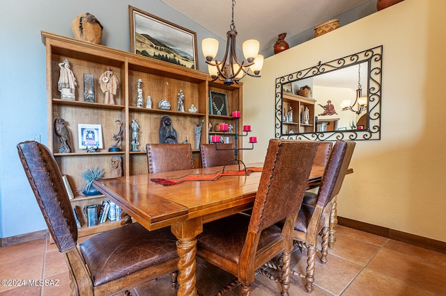 tiled dining area with a chandelier