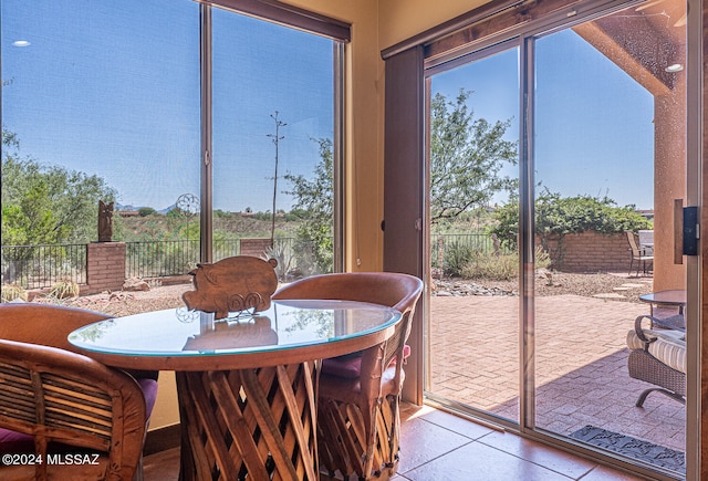 dining space with light tile patterned flooring