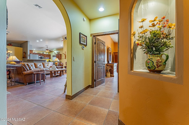 corridor featuring light tile patterned floors