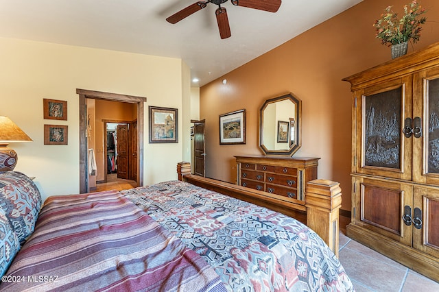 bedroom with light tile patterned flooring and ceiling fan