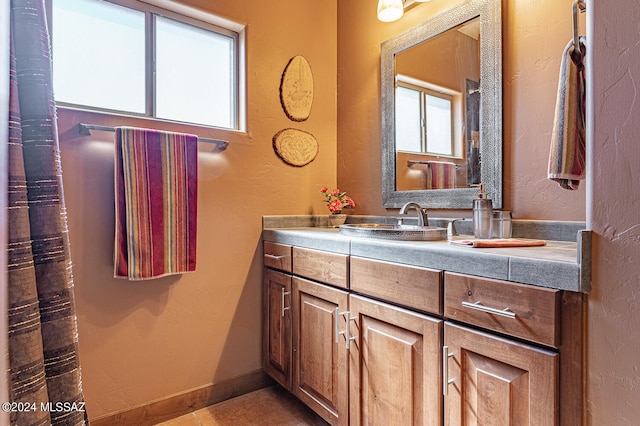 bathroom featuring vanity and tile patterned flooring