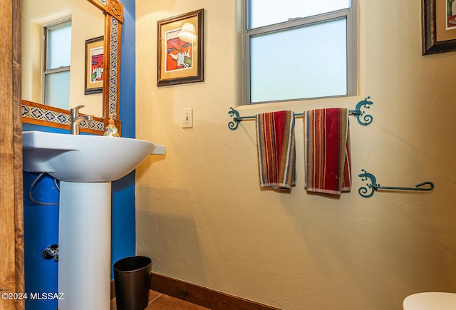 bathroom featuring tile patterned flooring and toilet