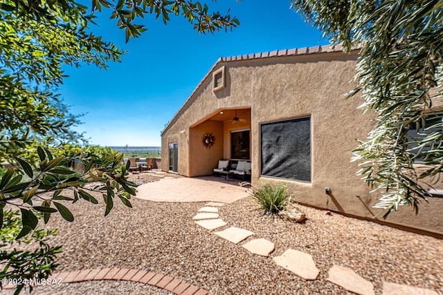 back of property with a patio area