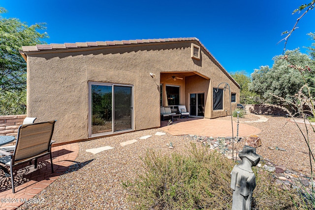 rear view of house with a patio