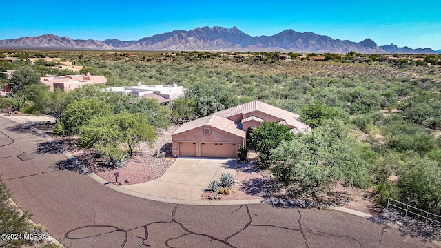 birds eye view of property featuring a mountain view