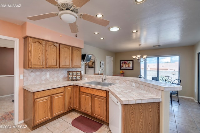 kitchen featuring backsplash, white appliances, a kitchen bar, and kitchen peninsula