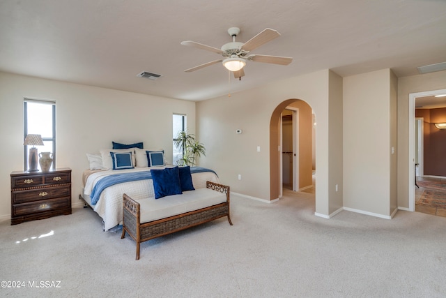 bedroom featuring ceiling fan and carpet