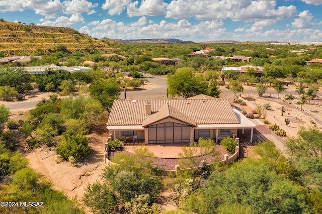 back of property with a patio