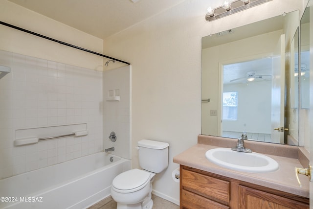 full bathroom with vanity, ceiling fan, toilet, and tiled shower / bath