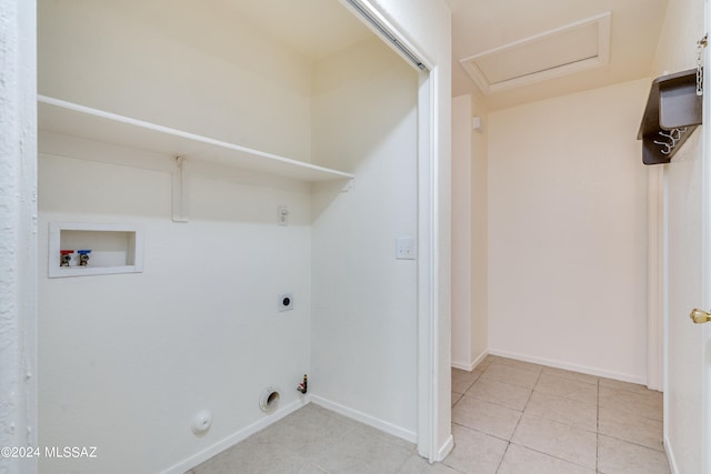 clothes washing area featuring washer hookup, hookup for a gas dryer, electric dryer hookup, and light tile patterned flooring