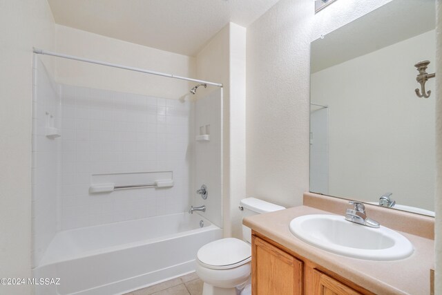 full bathroom featuring tile patterned floors, vanity, tub / shower combination, and toilet