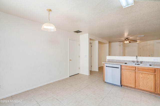 kitchen featuring stainless steel dishwasher, ceiling fan, sink, pendant lighting, and light tile patterned floors