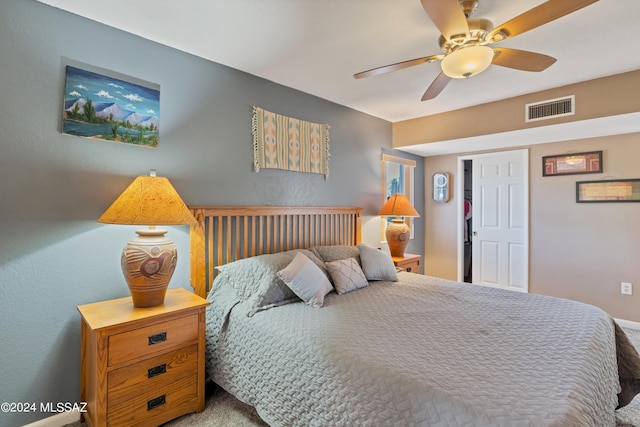 bedroom featuring ceiling fan, visible vents, and carpet flooring