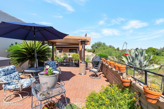 view of patio with outdoor dining area and a grill