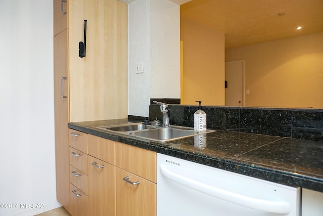 kitchen featuring dishwasher, sink, and light brown cabinets