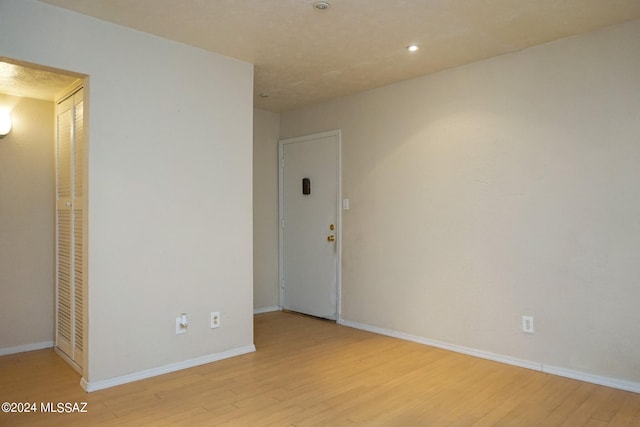 unfurnished room with light hardwood / wood-style flooring