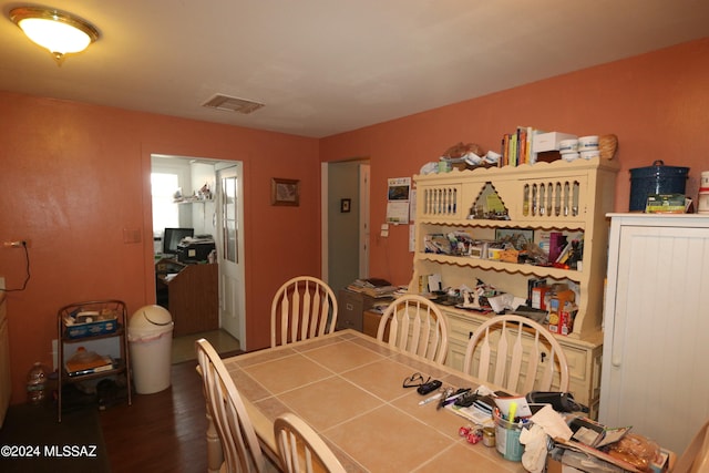 dining room with dark wood-type flooring