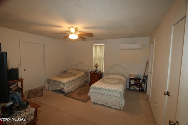 bedroom with carpet flooring, ceiling fan, and a wall unit AC